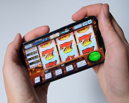 Mobile gaming demonstration shown on a smartphone screen during a technology showcase